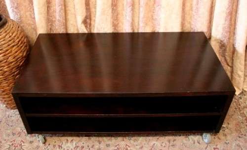 A stunning stylish wooden TV stand on wheels with place for your entertainment centre