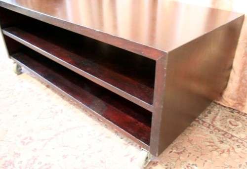 A stunning stylish wooden TV stand on wheels with place for your entertainment centre