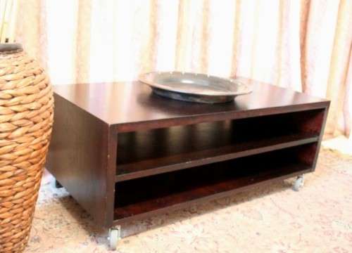 A stunning stylish wooden TV stand on wheels with place for your entertainment centre