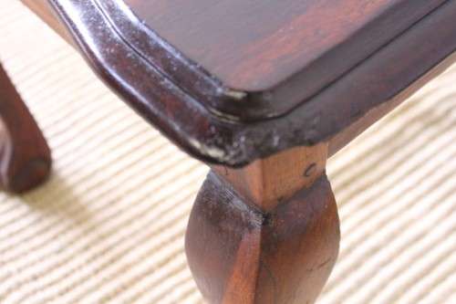 A beautiful vintage scalloped edge solid African Stink wood ball and claw coffee/ side table