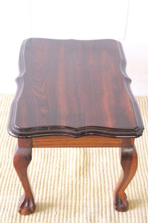 A beautiful vintage scalloped edge solid African Stink wood ball and claw coffee/ side table