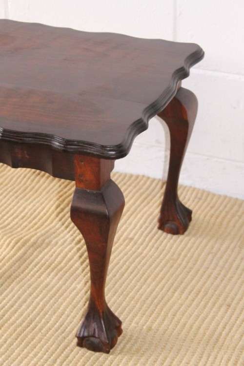 A great size vintage scalloped edge solid African Stink wood ball and claw coffee/ side table