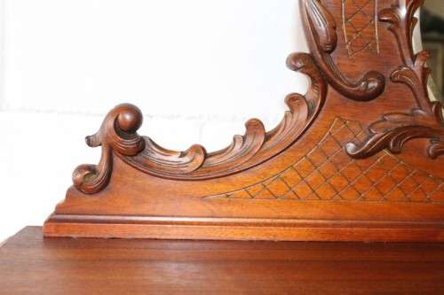 A beautiful antique French Mahogany cabinet with curved glass doors and a bevelled glass mirror