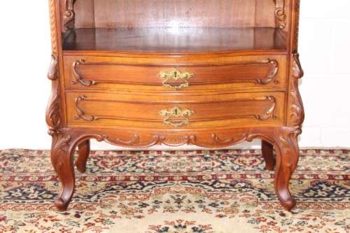 A beautiful antique French Mahogany cabinet with curved glass doors and a bevelled glass mirror