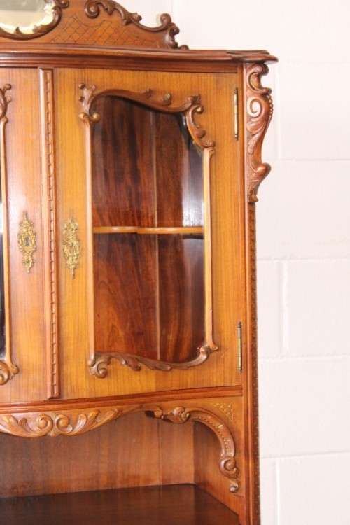 A beautiful antique French Mahogany cabinet with curved glass doors and a bevelled glass mirror