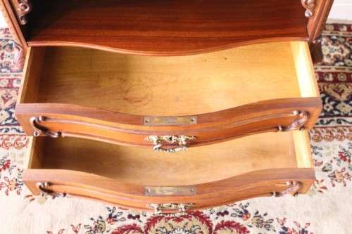 A beautiful antique French Mahogany cabinet with curved glass doors and a bevelled glass mirror