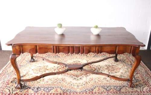 A vintage stink-wood scalloped edge ball and claw cross-brace 6-8-seater D/Table. Lifespace Sale