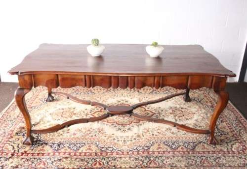 A vintage stink-wood scalloped edge ball and claw cross-brace 6-8-seater D/Table. Lifespace Sale