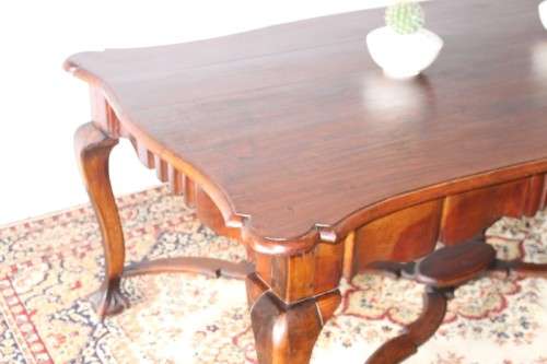 A vintage stink-wood scalloped edge ball and claw cross-brace 6-8-seater D/Table. Lifespace Sale