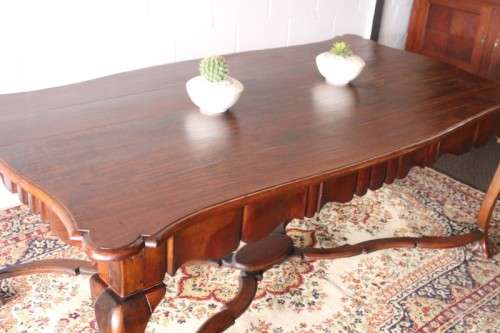 A vintage stink-wood scalloped edge ball and claw cross-brace 6-8-seater D/Table. Lifespace Sale