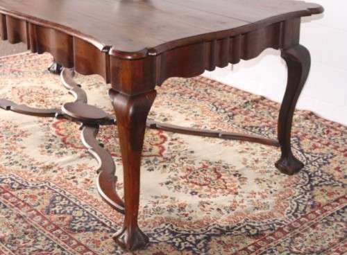 A vintage stink-wood scalloped edge ball and claw cross-brace 6-8-seater D/Table. Lifespace Sale