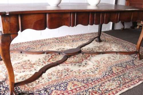 A vintage stink-wood scalloped edge ball and claw cross-brace 6-8-seater D/Table. Lifespace Sale