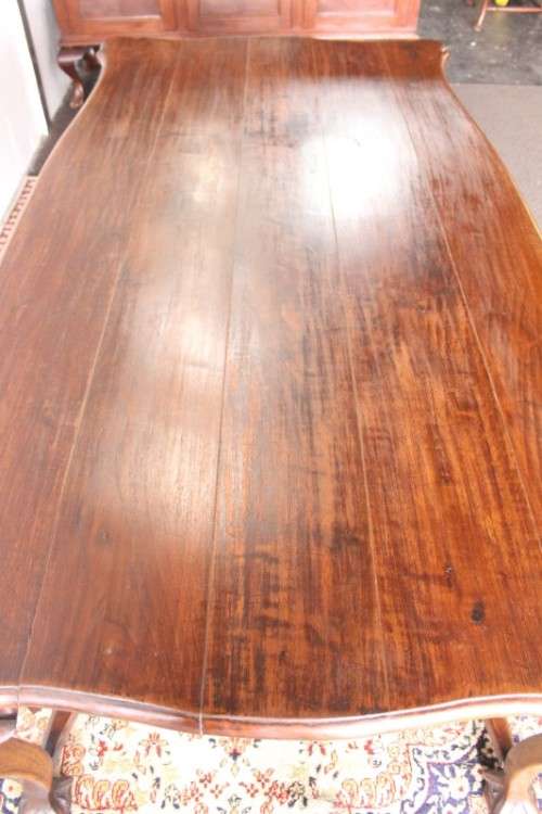 A vintage stink-wood scalloped edge ball and claw cross-brace 6-8-seater D/Table. Lifespace Sale