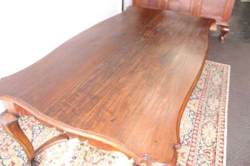 A vintage stink-wood scalloped edge ball and claw cross-brace 6-8-seater D/Table. Lifespace Sale