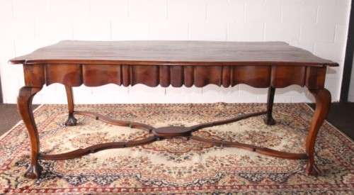 A vintage stink-wood scalloped edge ball and claw cross-brace 6-8-seater D/Table. Lifespace Sale