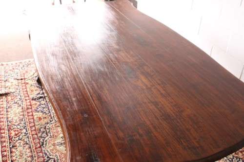 A vintage stink-wood scalloped edge ball and claw cross-brace 6-8-seater D/Table. Lifespace Sale