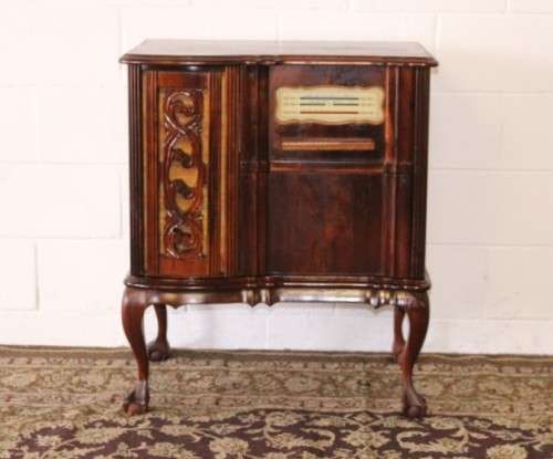 An awesome and solidly made vintage solid Imbuia ball and claw Radiogram cabinet