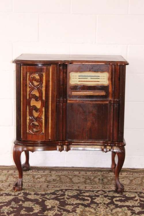 An awesome and solidly made vintage solid Imbuia ball and claw Radiogram cabinet