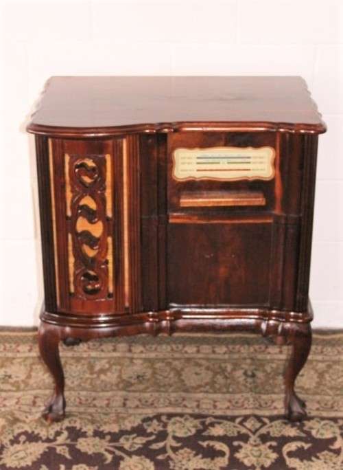 An awesome and solidly made vintage solid Imbuia ball and claw Radiogram cabinet