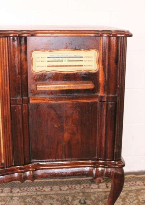 An awesome and solidly made vintage solid Imbuia ball and claw Radiogram cabinet