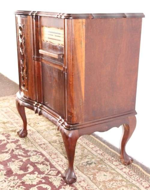 An awesome and solidly made vintage solid Imbuia ball and claw Radiogram cabinet