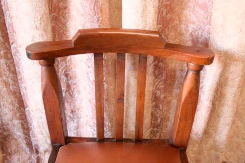 **RS17** A lovely and very well made antique oak chair with a brown PU leather upholstered seat
