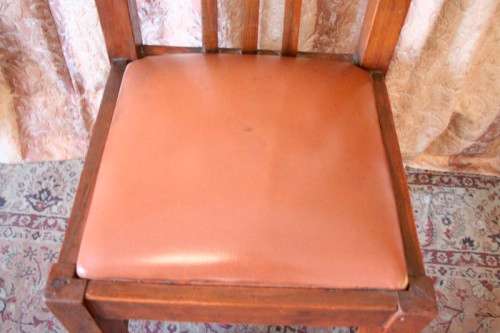 **RS17** A lovely and very well made antique oak chair with a brown PU leather upholstered seat