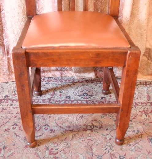 **RS17** A lovely and very well made antique oak chair with a brown PU leather upholstered seat