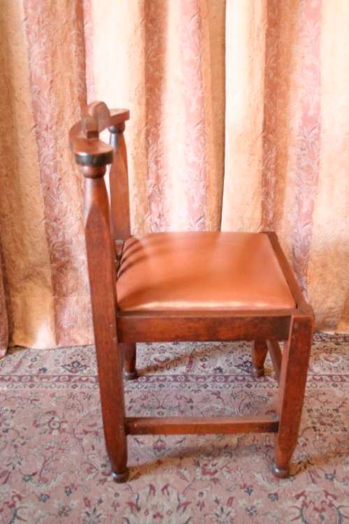 **RS17** A lovely and very well made antique oak chair with a brown PU leather upholstered seat