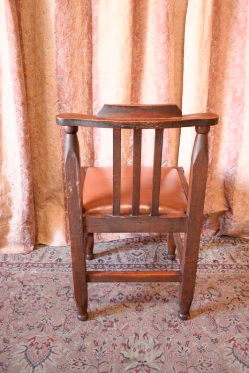 **RS17** A lovely and very well made antique oak chair with a brown PU leather upholstered seat