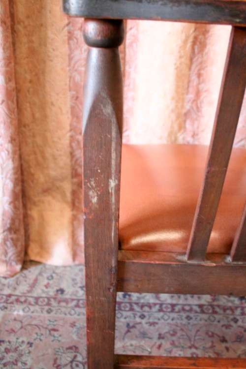 **RS17** A lovely and very well made antique oak chair with a brown PU leather upholstered seat
