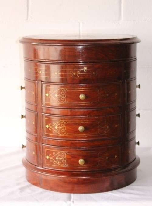 A spectacular and beautifully made solid rosewood round 12-drawer jewellery chest with brass inlay