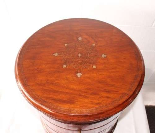 A spectacular and beautifully made solid rosewood round 12-drawer jewellery chest with brass inlay