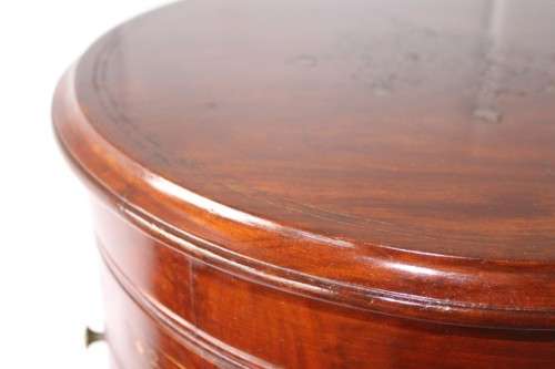 A spectacular and beautifully made solid rosewood round 12-drawer jewellery chest with brass inlay