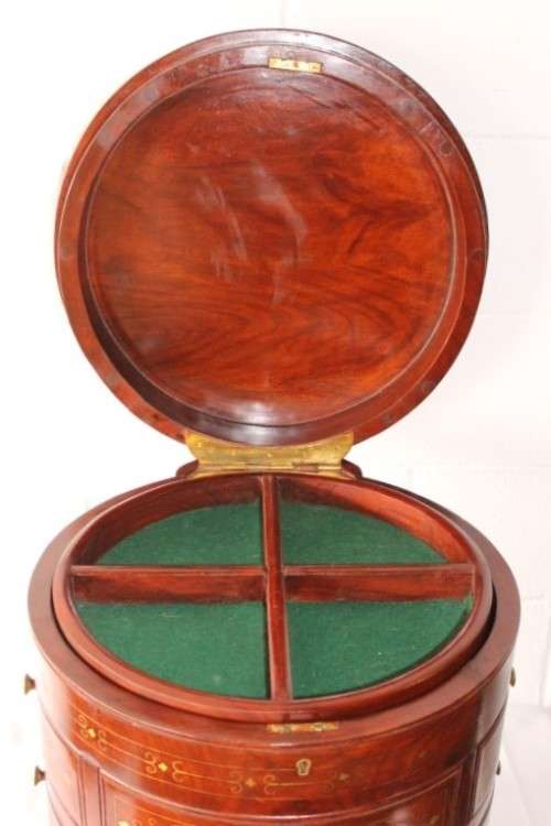 A spectacular and beautifully made solid rosewood round 12-drawer jewellery chest with brass inlay