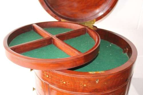 A spectacular and beautifully made solid rosewood round 12-drawer jewellery chest with brass inlay