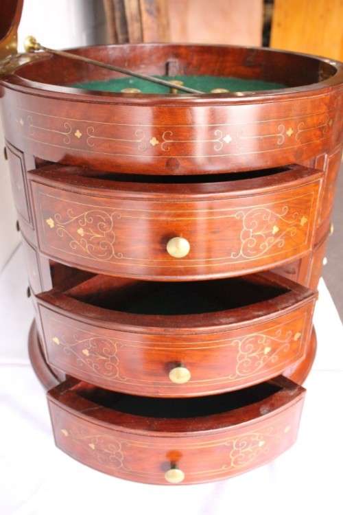 A spectacular and beautifully made solid rosewood round 12-drawer jewellery chest with brass inlay