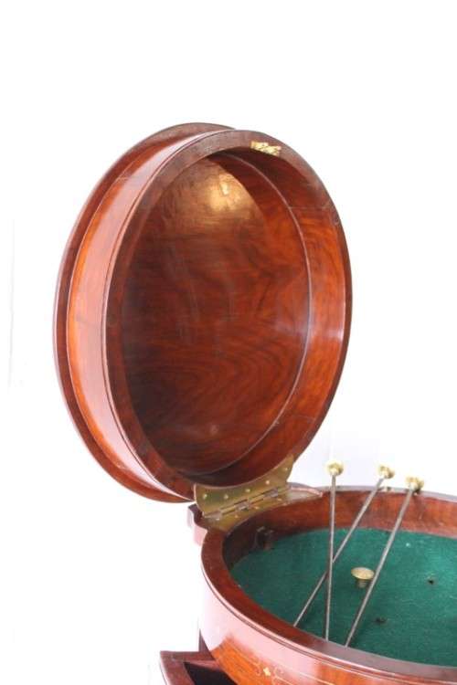 A spectacular and beautifully made solid rosewood round 12-drawer jewellery chest with brass inlay