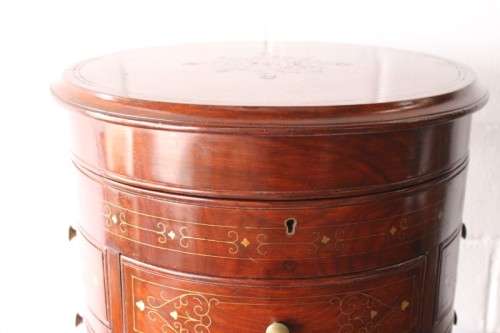 A spectacular and beautifully made solid rosewood round 12-drawer jewellery chest with brass inlay