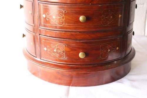 A spectacular and beautifully made solid rosewood round 12-drawer jewellery chest with brass inlay