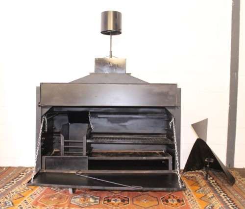 An awesome (1.2m) steel double-door built in braai w/ potjie hook, ash trays, rotating cowel & more