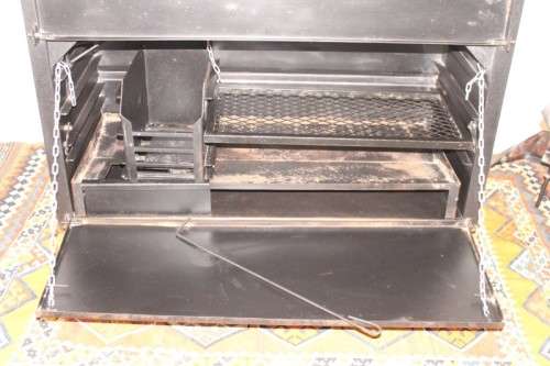 An awesome (1.2m) steel double-door built in braai w/ potjie hook, ash trays, rotating cowel & more