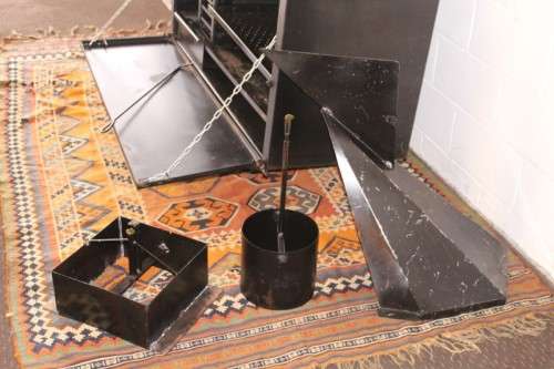 An awesome (1.2m) steel double-door built in braai w/ potjie hook, ash trays, rotating cowel & more