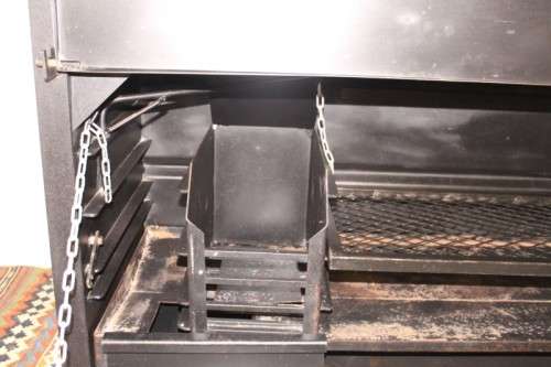 An awesome (1.2m) steel double-door built in braai w/ potjie hook, ash trays, rotating cowel & more