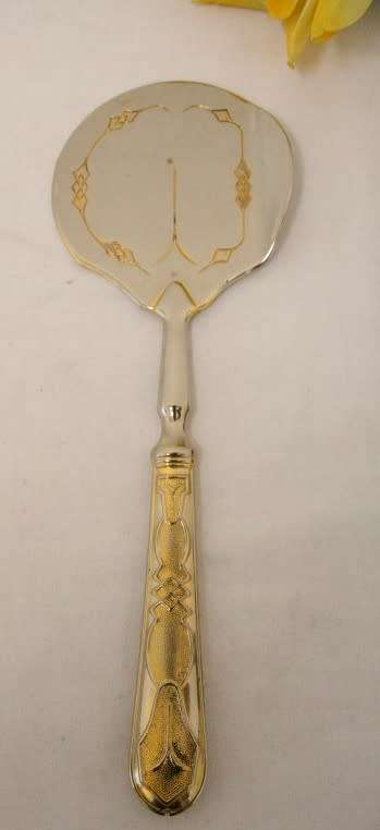 A gorgeous vintage silver plate/gold plated three piece cake/pastry lifting set in good condition