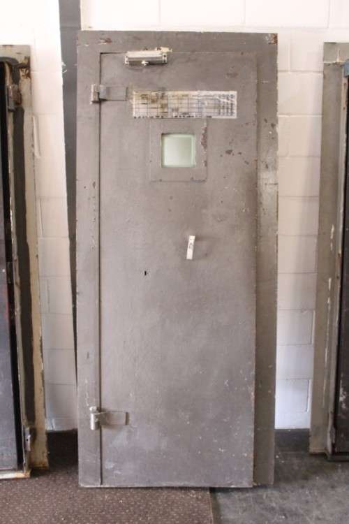 A large steel strongroom/ vault security door w/ a window - perfect for office or home installation