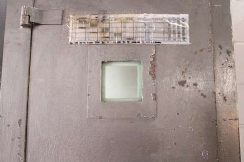 A large steel strongroom/ vault security door w/ a window - perfect for office or home installation