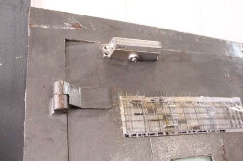 A large steel strongroom/ vault security door w/ a window - perfect for office or home installation