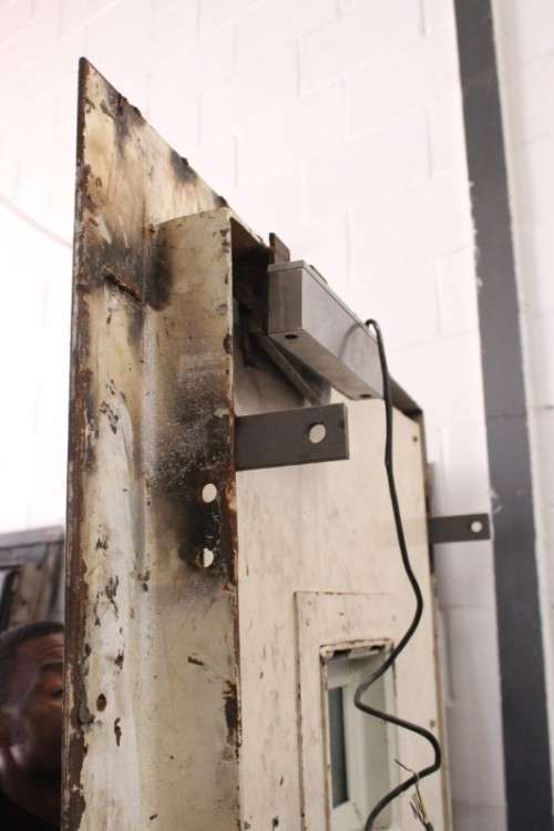 A large steel strongroom/ vault security door w/ a window - perfect for office or home installation