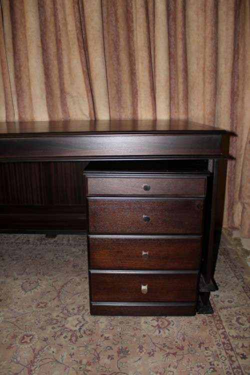 An amazing 'new" well made large darkened Oak executives desk with a 4 drawer removable pedestal